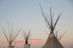 The sun sets as festivities continue at North American Indian Days in Browning, Montana.